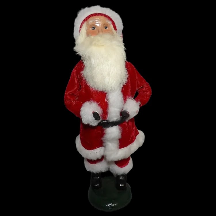 Byers’ Choice 13” The Santa Caroler 1987: Vintage 1987 Santa caroler figure from the Santa & Mrs. Claus collection. Signed 'Byer 87', stands 13” tall with a full foil sticker on the base. Shipping:Domestic: Flat-rate of $17.00 to