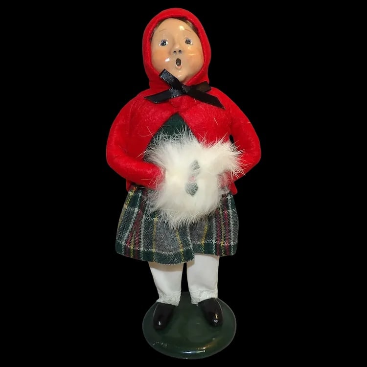 Byers’ Choice 1989 Girl with Hand Warmer: Vintage 1989 caroler figure featuring a girl with blonde hair and a pink skirt holding a hand muff. Signed 'Byer 89', stands 9 ½” tall. Shipping:Domestic: Flat-rate of $15.00 to anywhere