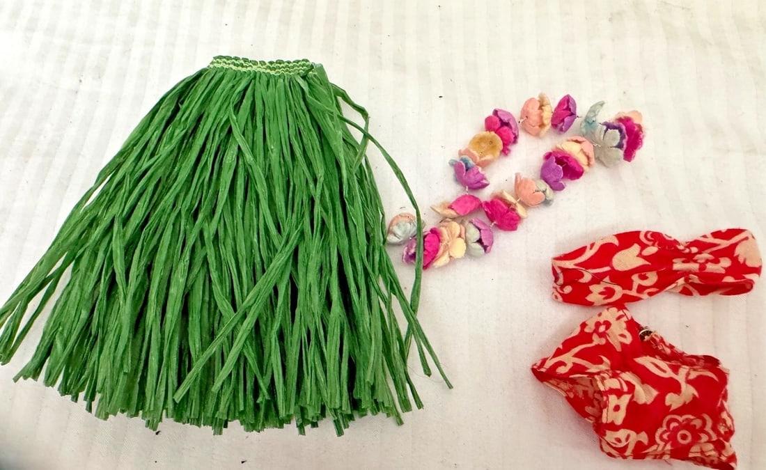 Vintage 1963 Barbie outfit #1605 Barbie in Hawaii: The Vintage 1963 Barbie outfit #1605 Barbie in Hawaii is a multicolor clothing set designed for an 11-inch Barbie doll. Made of cloth by Mattel, this original Barbie outfit from the 1960s is perfect