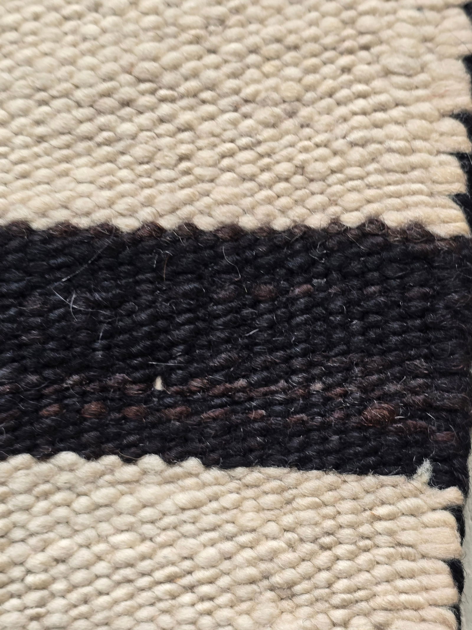 Navajo double saddle blanket: Title: Navajo double saddle blanket Dimension: 45" X 34" Description: Very good Navajo woven double saddle balanket. Possibly Crystal area. Banded in natural white and grey brown stripes containing bl