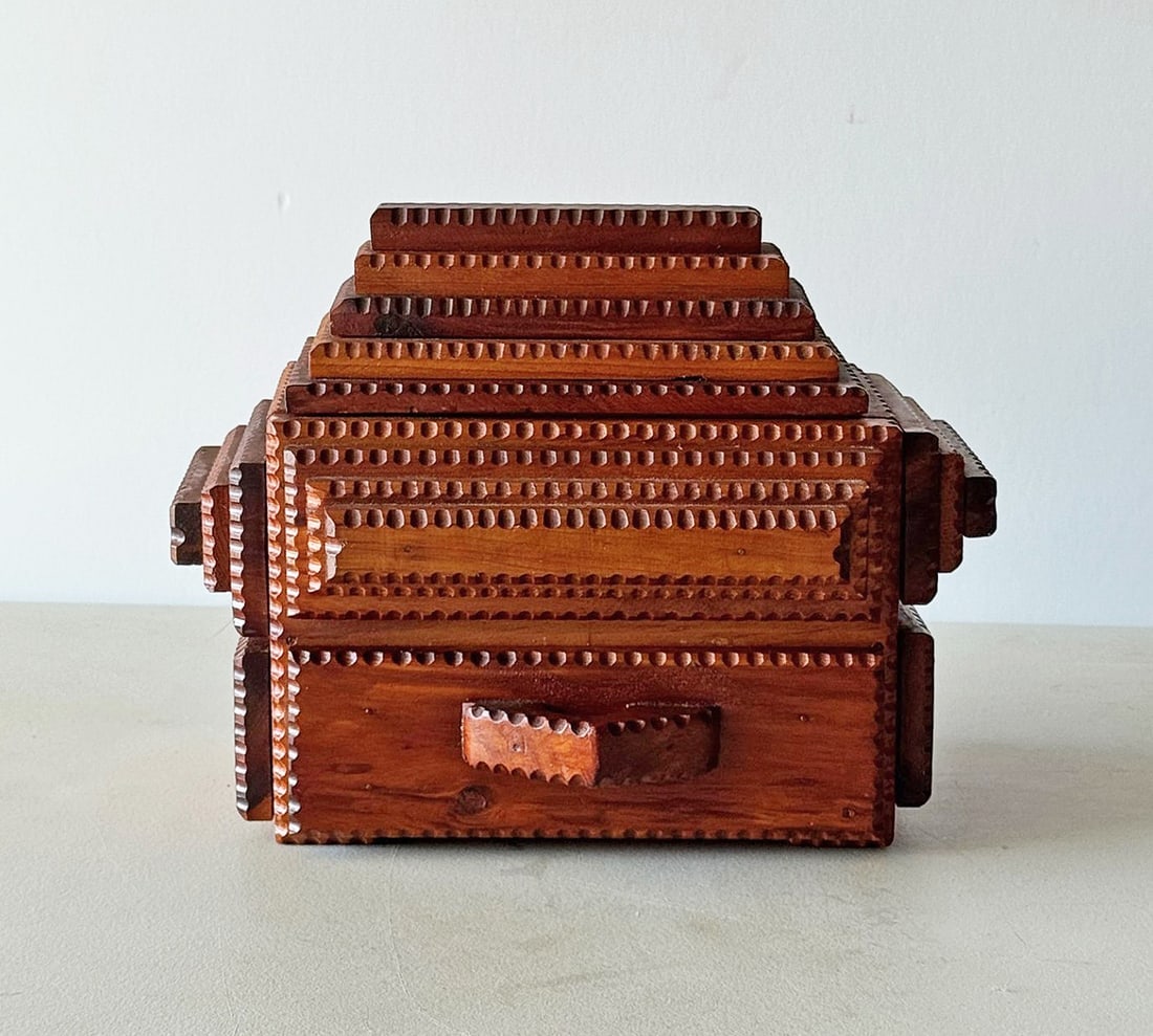 Historically Important Tramp Art Box by Gus Wynn: Description: A fine historically important tramp art box by the colorful Gus Wynn. The box exhibits the unique characteristics of his signature style, having a sliding top, and drawer. It is one of