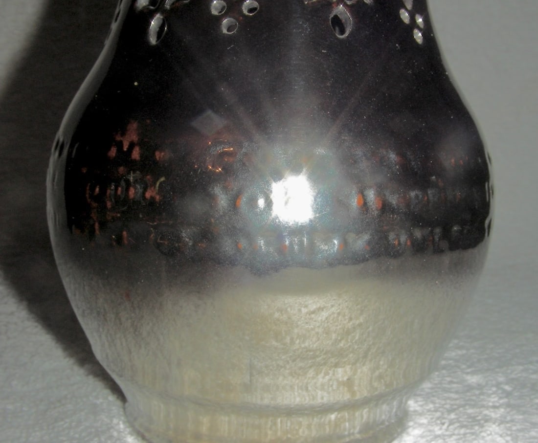 2 Leeds Silver Luster Puzzle Jugs, Late 19th C: A pair of late 19th century Leeds (marked)) Silver Luster Puzzle Jug with 3 spouts and an impressed verse on the belly of each jug. The cut-out or pierced portion at the tops, above and below the