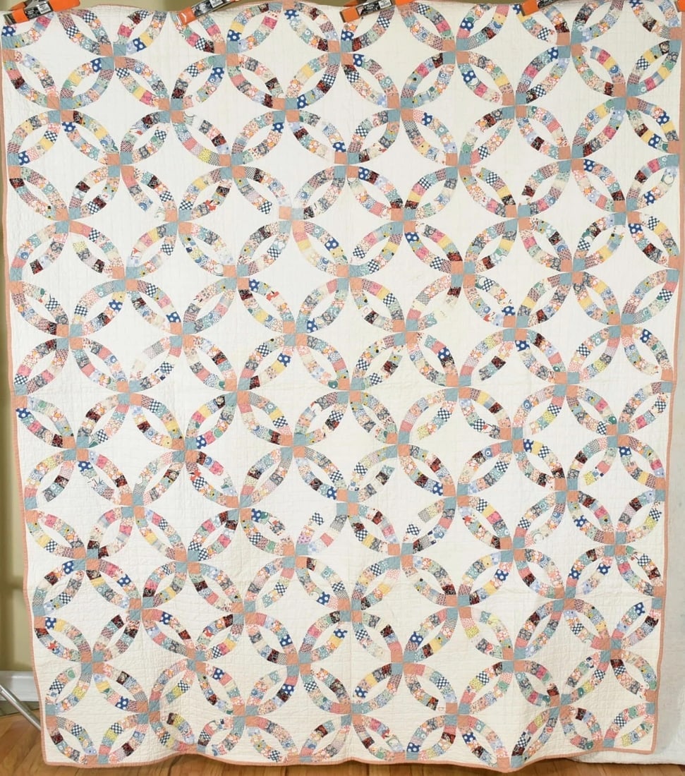 30's Double Wedding Ring Quilt, Small Pieces: This beautiful cotton 30's double wedding ring quilt is all hand pieced and hand quilted, with solid dusty rose and nile green joiners. It measures 72" X 82" and is in excellent condition, with a coup