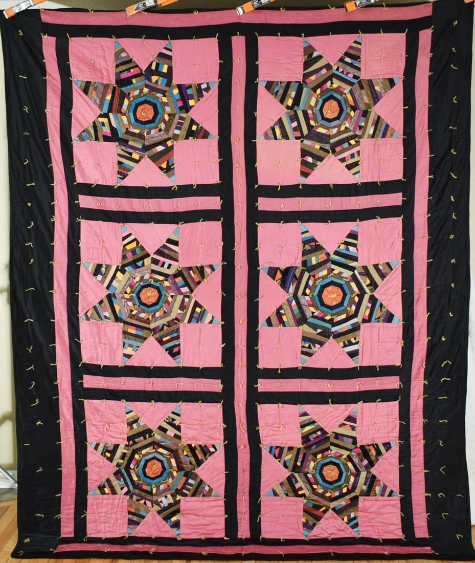30's Amish Strip Star Quilt: This VIBRANT cotton 30's Amish pieced stars tied quilt is treadle machine pieced, with a muted pink and deep black background. It measures 78" X 100" and is in excellent, never washed condition, with