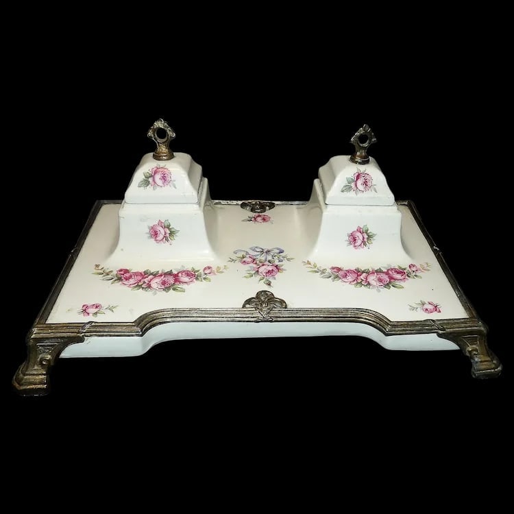 Antique Victorian Porcelain Inkwell: Striking display item with spelter metal and brass overlay. Measures 11 ¼” x 7 1/8” x 4 ¾”. No chips or cracks. Item ID: ls009604. Shipping:Domestic: Flat-rate of $20.00