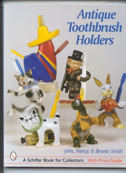 Antique Toothbrush Holders Book: Title: Antique Toothbrush Holders BookDimension: 8 1/2” wide x 11” tall.Date: ---Additional Information: Book on Antique Toothbrush Holders by John, Nancy & Brooke Smith. A must Guide for