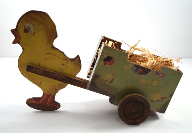 Easter Chick Pulling Cart Candy Container Toy: Title: Easter Chick Pulling Cart Candy Container ToyDimension: 6 1/2” tall x 10” long x 4” wide.Date: Ca. 1950’s.Additional Information: Exceptionally nice Vintage Easter