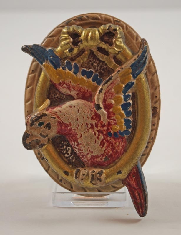 Antique Parrot in Ring Cast Iron Hubley Doorknocker: Title: Antique Parrot in Ring Cast Iron Hubley DoorknockerDimension: Very good condition with original paint.Date: Ca. 1920’s-30’s.Additional Information: Multi-colored Parrot Flying thru