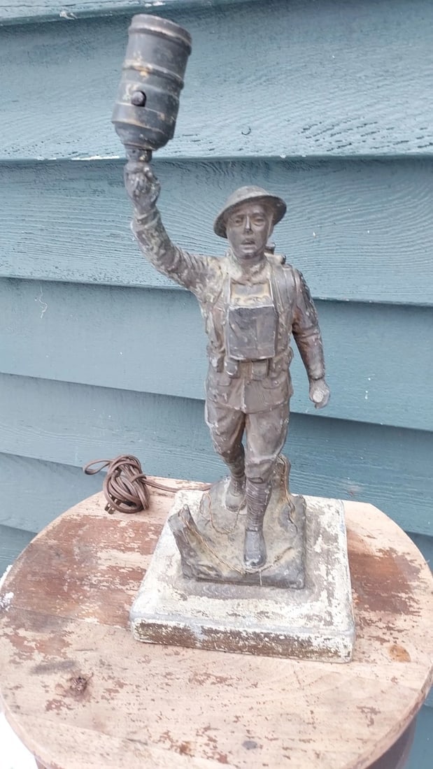 Figural Lamp Doughboy WWI 1920 Metal Lamp Base: Great looking piece in good condition physically . Well done. Gun is missing. I usually see hand replaced this one is intact. E M Viguernsey sculpture Americus Georgia. Dates to 1920. 14" . Shipping