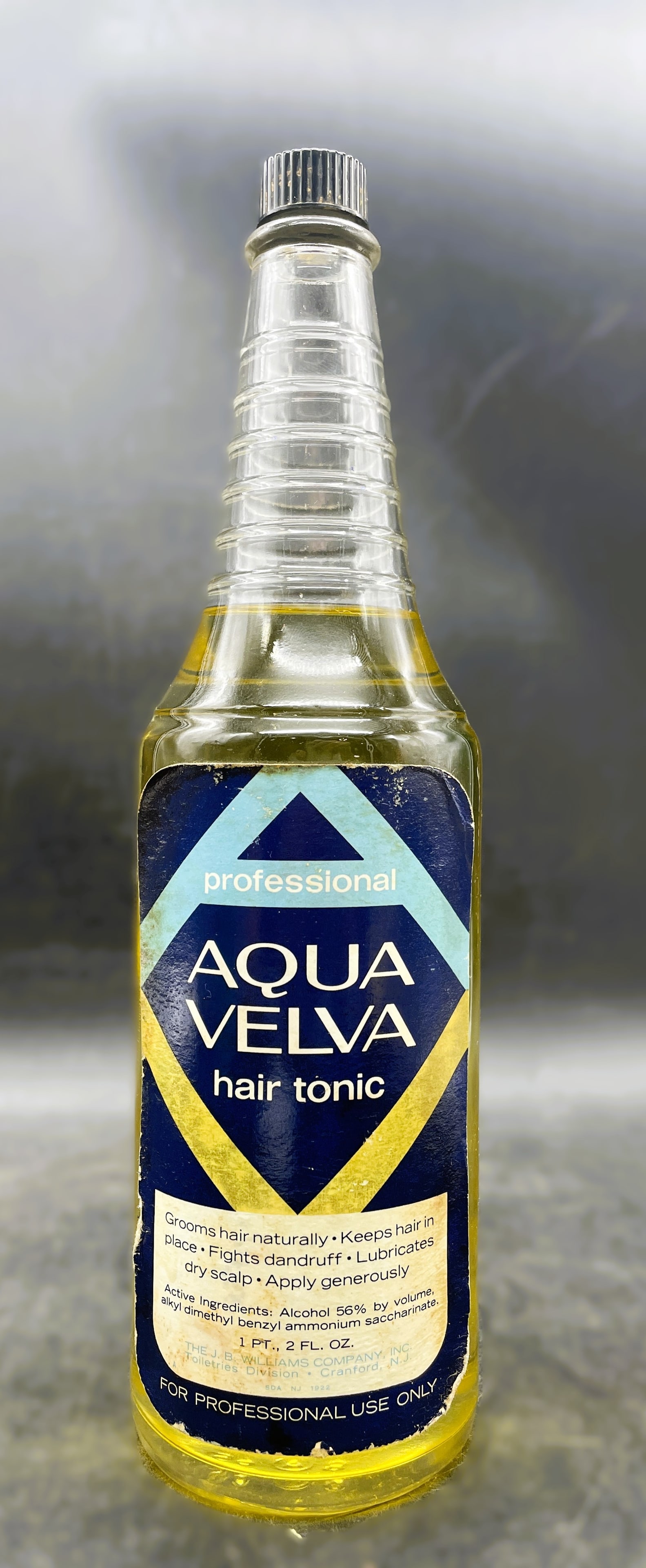 VINTAGE AQUA VELVA HAIR TONIC Barber Bottle, J.B. WILLIAMS CO. PROFESSIONAL USE: Date/Period: Approx 1930-50'sDimension: Approx. 10.25" tallMaterial: glassAdditional Information: VINTAGE Aqua Velva hair tonic. 1 pint bottle is glass. Pretty amber color of contents will make a