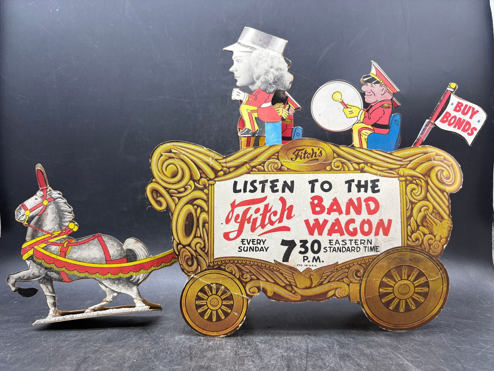 WWII Ringling Bros Barnum & Bailey Fitch Bandwagon Radio Show Counter Display: Date/Period: Approx 1940'sDimension: Approx 16" long x 11" x 3" wideMaterial: cardboard/paperAdditional Information: Extremely hard to find piece of memorabilia from the WWII. This cardboard
