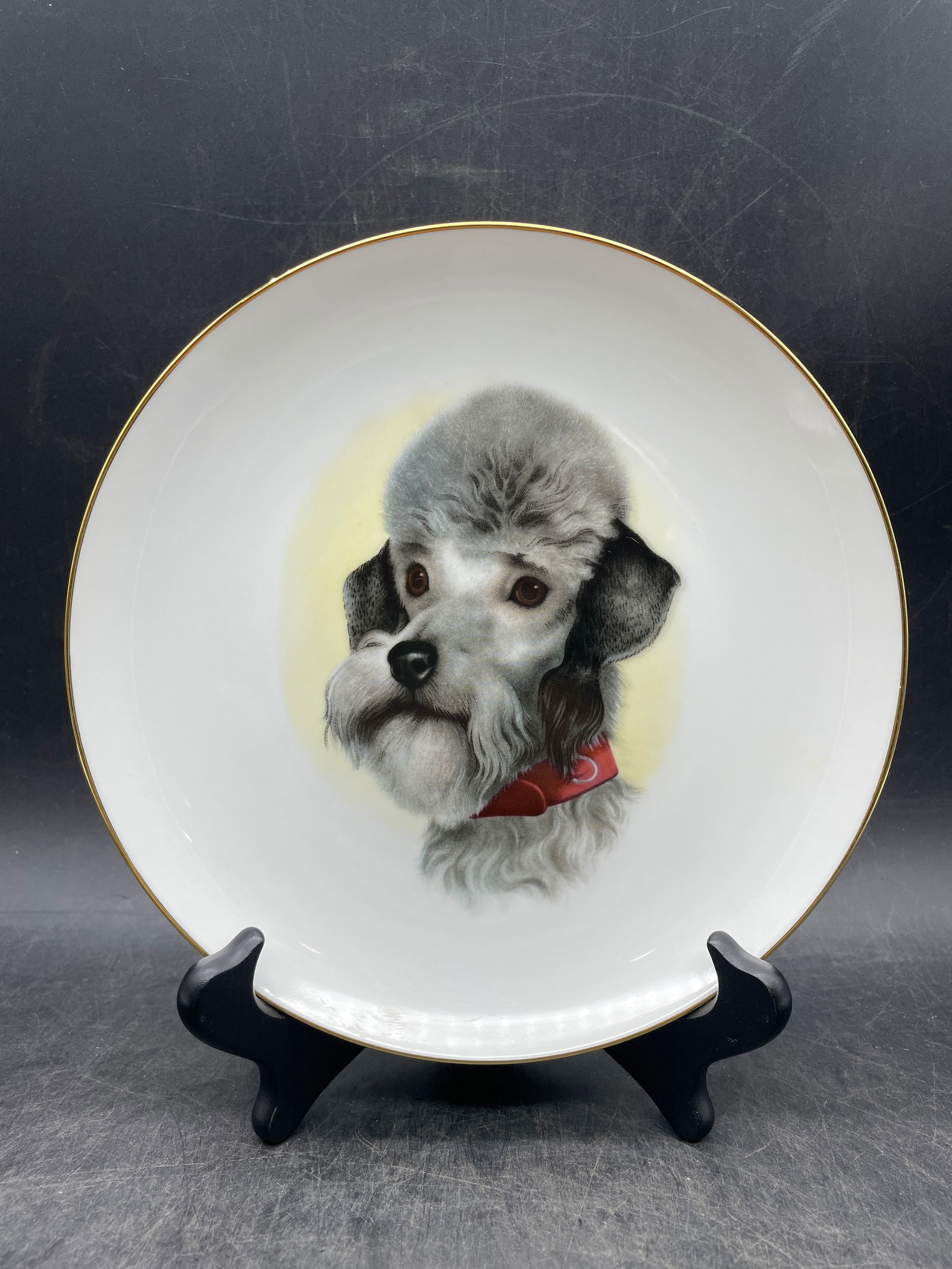 Retro 1950's Poodle Plate USA: Date/Period: Approx. 1950'sDimension: Approx. 7.5" diameterMaterial: ceramicAdditional Information: Vintage Poodle Plate USA Shipping:Domestic: Flat-rate of $10.00 to anywhere within the contiguous