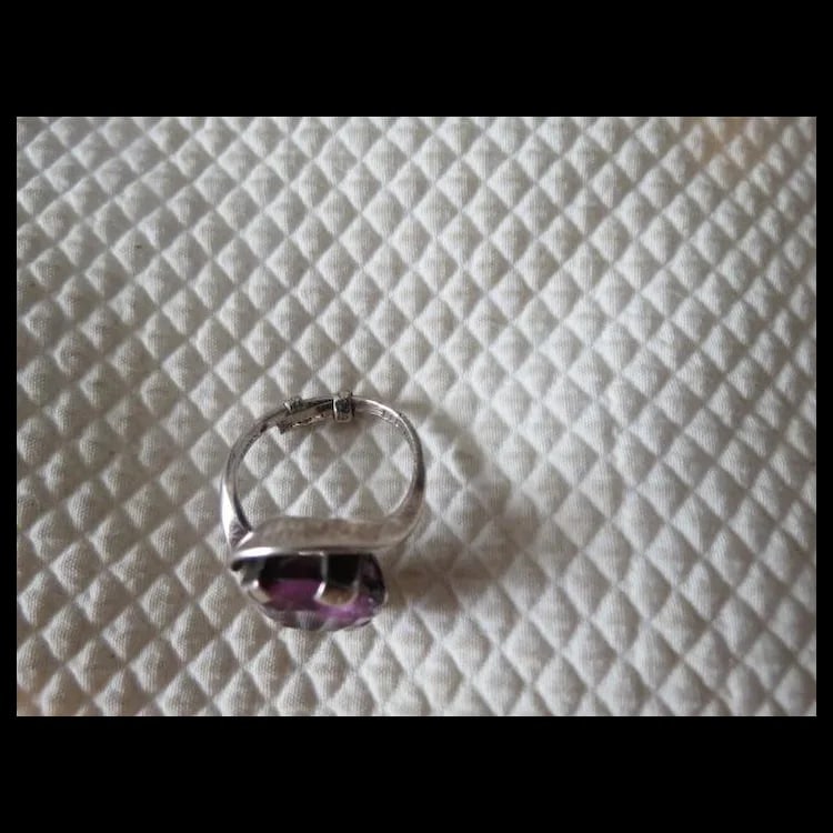Vintage Mid-Century Modern Purple sapphire Sterling Silver Ring: Mid-century modern style sterling silver ring set with a purple sapphire. Size 6 3/4. Shipping:Domestic: Flat-rate of $10.00 to anywhere within the contiguous U.S.International: Foreign shipping
