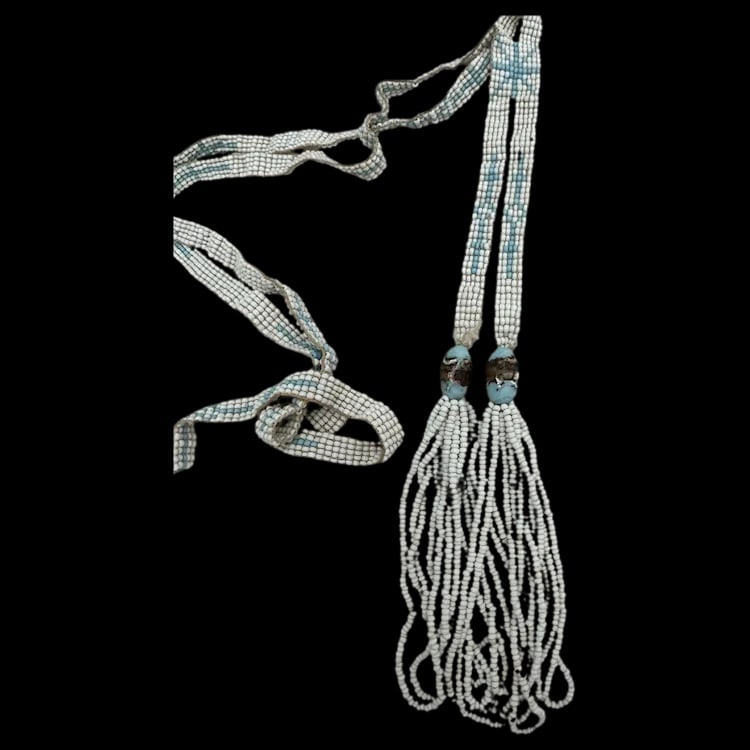 Antique Native American Indian Old Pawn Beaded Necklace: A vintage handcrafted necklace featuring intricate geometric patterns made with glass seed beads. Shipping:Domestic: Flat-rate of $10.00 to anywhere within the contiguous U.S.International: Foreign