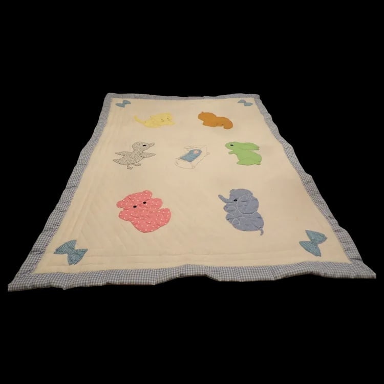 Machine Made Kids Baby Crib Quilt with Animals: Vintage crib quilt (51” x 38”) featuring various animal illustrations. Excellent condition with a blue and white checkered backside. Shipping: Domestic: Flat-rate of $15.00 to anywhere wit