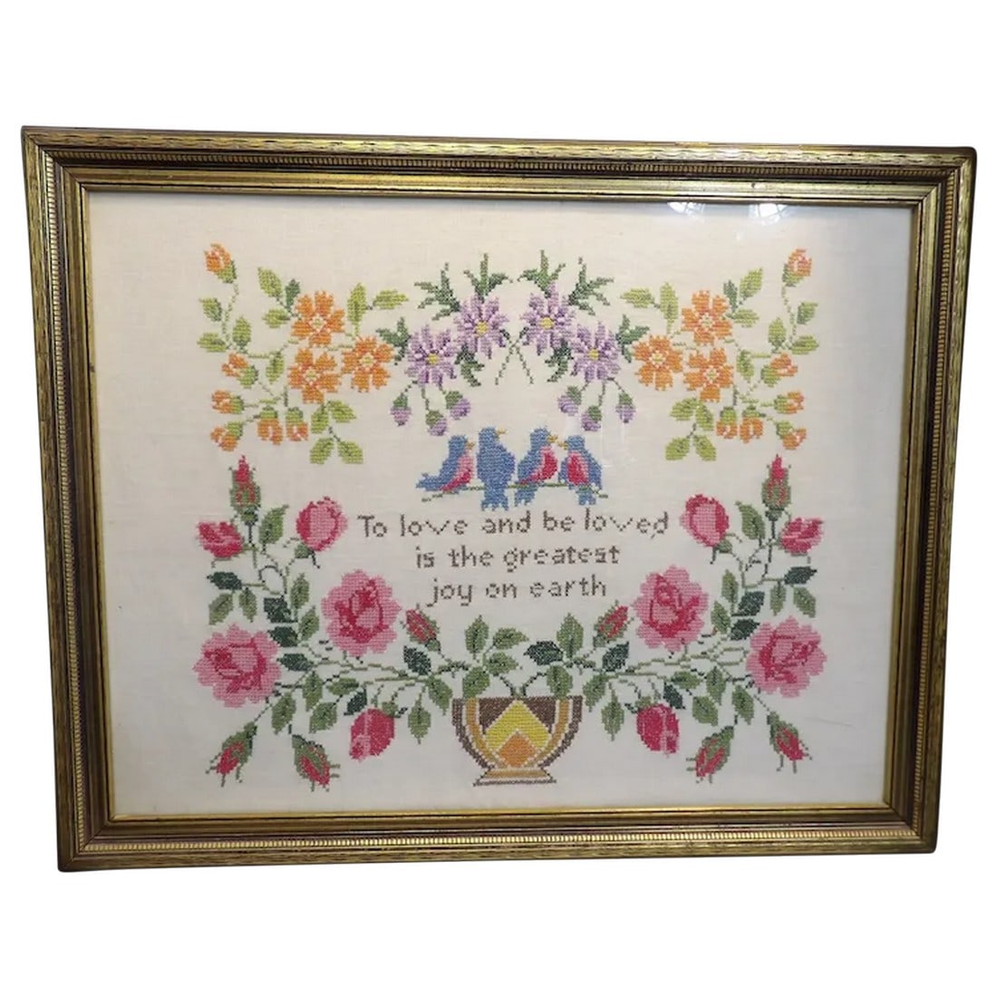 Vintage Romantic Needle Point Framed: Beautifully worked needlepoint depicting a romantic courtyard scene with a couple. Professionally framed in a gold-wash ornate frame. Item ID: ls009696. Shipping:Domestic: Flat-rate of $50.00 to