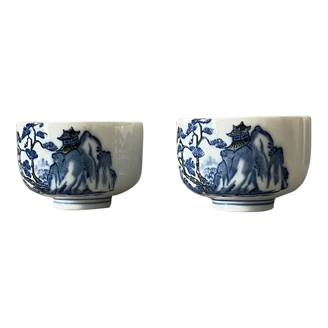 20th Century Hand-Painted Imperial Japanese Tea Cups- a Pair: Gorgeous pair of Japanese teacups in excellent condition. Handpainted, so you will see slight differences between the two. Perfect as decor or to use. Classic blue and white presentation with a hint