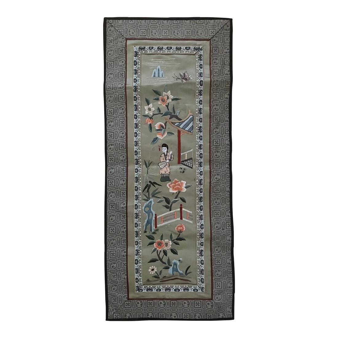 20th Century Chinese Embroidery Wall Hanging: Beautiful embroidery plainly visible in the 20th century Chinese wall hanging. Depicts a woman in traditional garb, a bridge over water, flowers, and mountains. Typical of scenes from this time