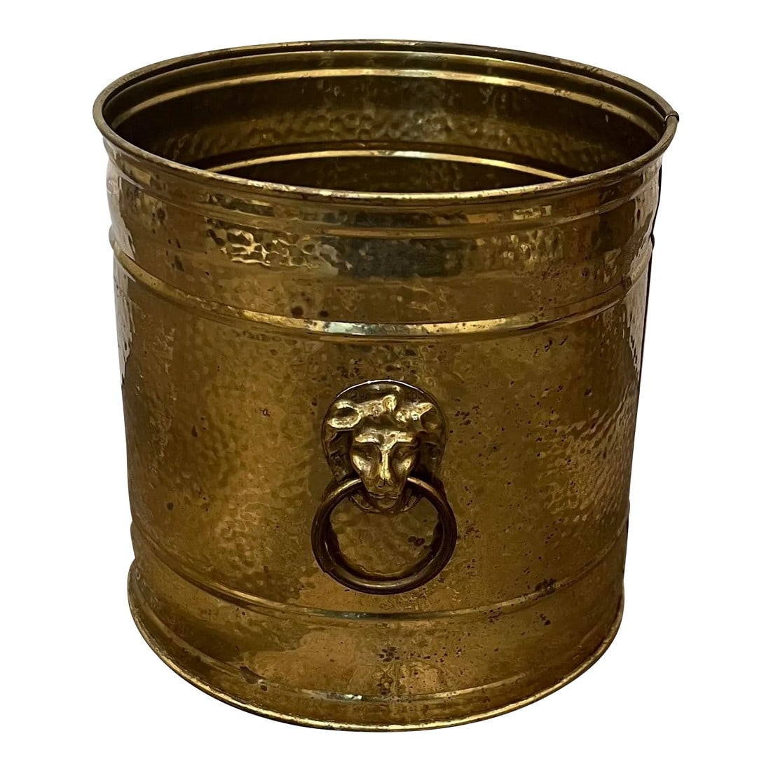 Lombard England Hammered Brass Lion Head Planter: Made by Lombard England, mid 20th century. Hand hammered, single sheet of thin brass held together well by circular molds at top and bottom. No leaks. Possible ice bucket at one point, has