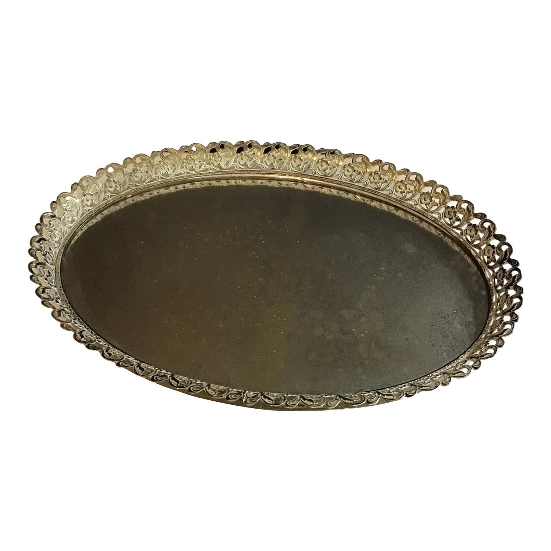 Hollywood Regency Vintage Mid-Century Modern Oval Gold Brass Filigree Ornate Vanity Tray With Mirror: Here is an elegant Vintage filigree oval tray with mirror Mirror has an antique finish Floral pierced tray edge Felt bottom Footed bottom Perfect for displaying and organizing your treasured perfumes