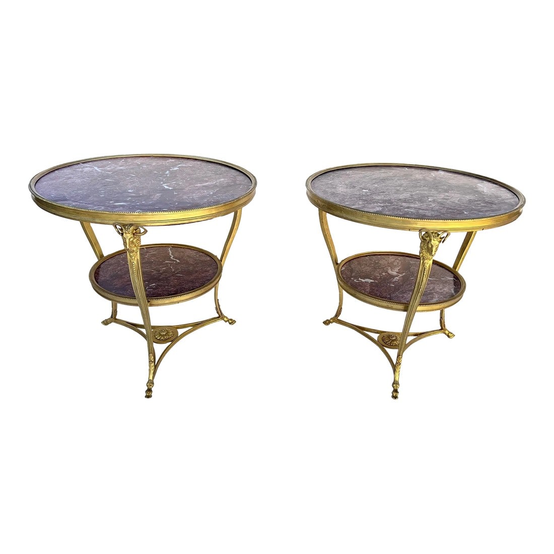 Early 20th Century French Bronze Ormolu Mounting and Rouge Marble Gueridon Table Side Tables- Set of: Early 20th century French empire style bronze Two-tier Gueridon table circular Rouge Marble top with a reeded border with three supports headed by Rams' heads, tapering legs ending in acanthus collar