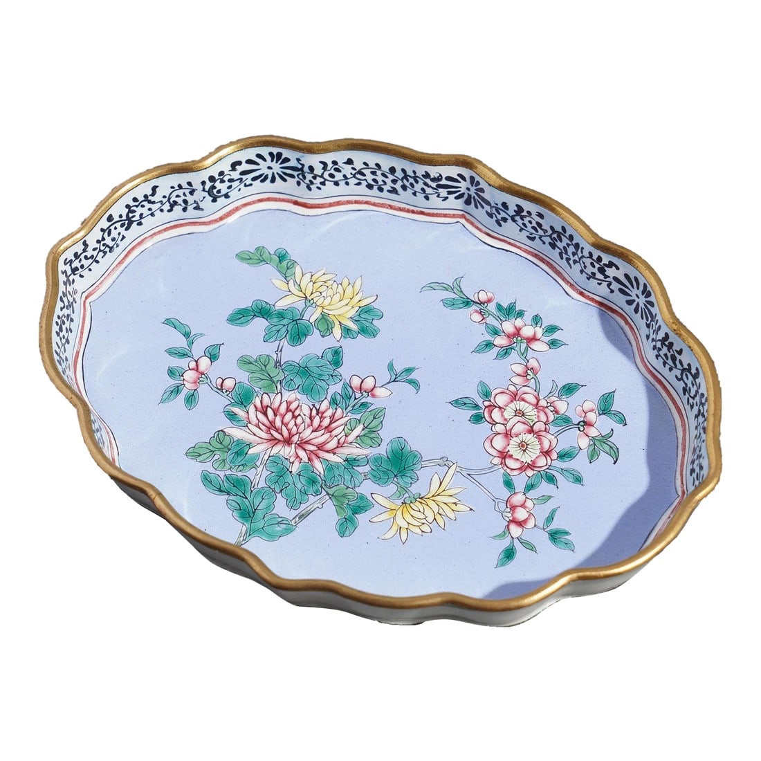Chinese Enameled Pin Tray Decorated With Mums & Cherry Blossoms, 1950's: Standing rim enameled brass shaped pin tray. The decoration of mums & cherry blossoms on a periwinkle blue ground is framed with black trailing vine on the interior of the standing rim. China, mid