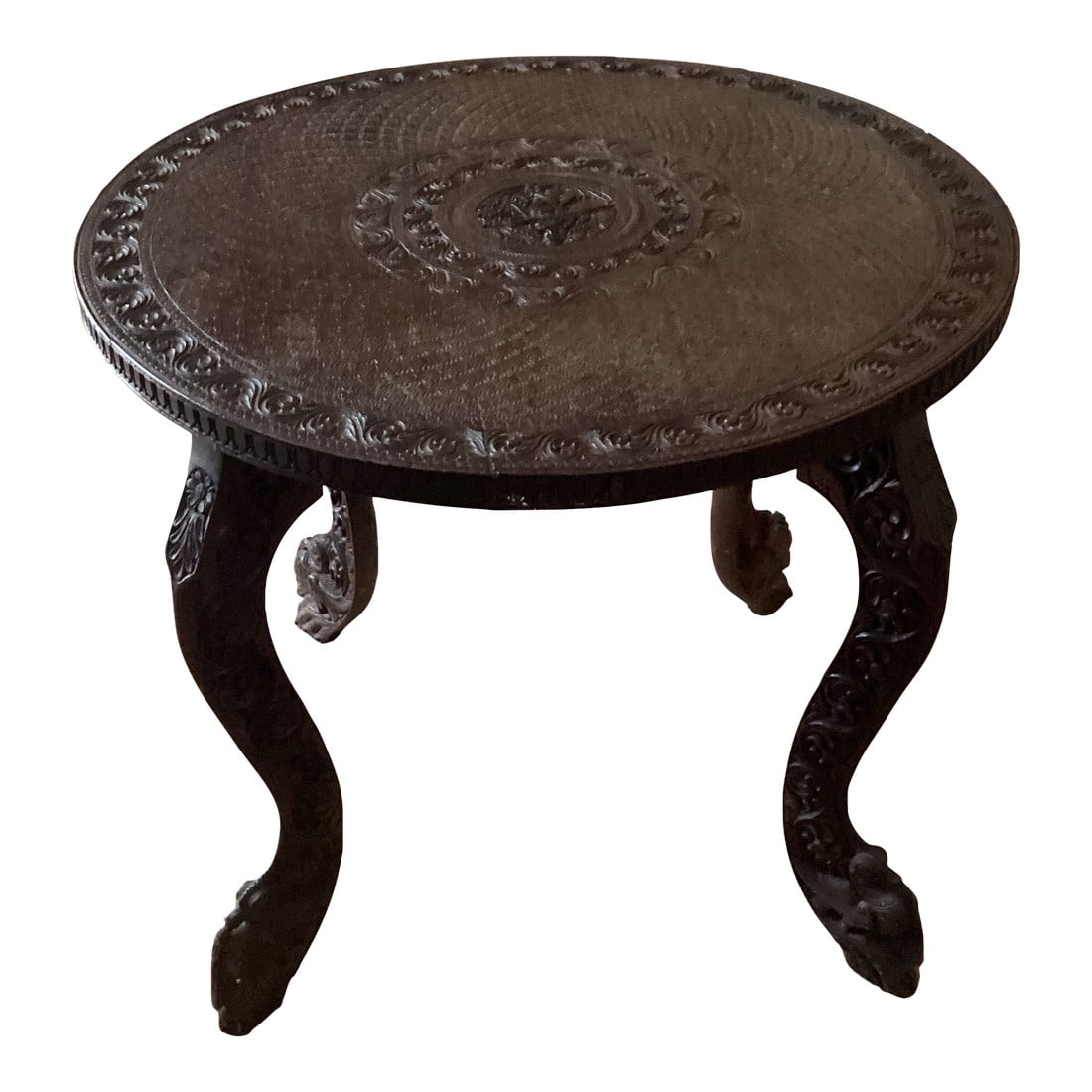 1960s Vintage Anglo-Indian Hand Crafted Hardwood Round Side Table Carved Legs & Top: Hand Crafted Solid Wood intricately carved side accent table from India Table top and four legs have relief carvings. Ideal size table for entryway, chair side table, drink table, bedside, nightstand