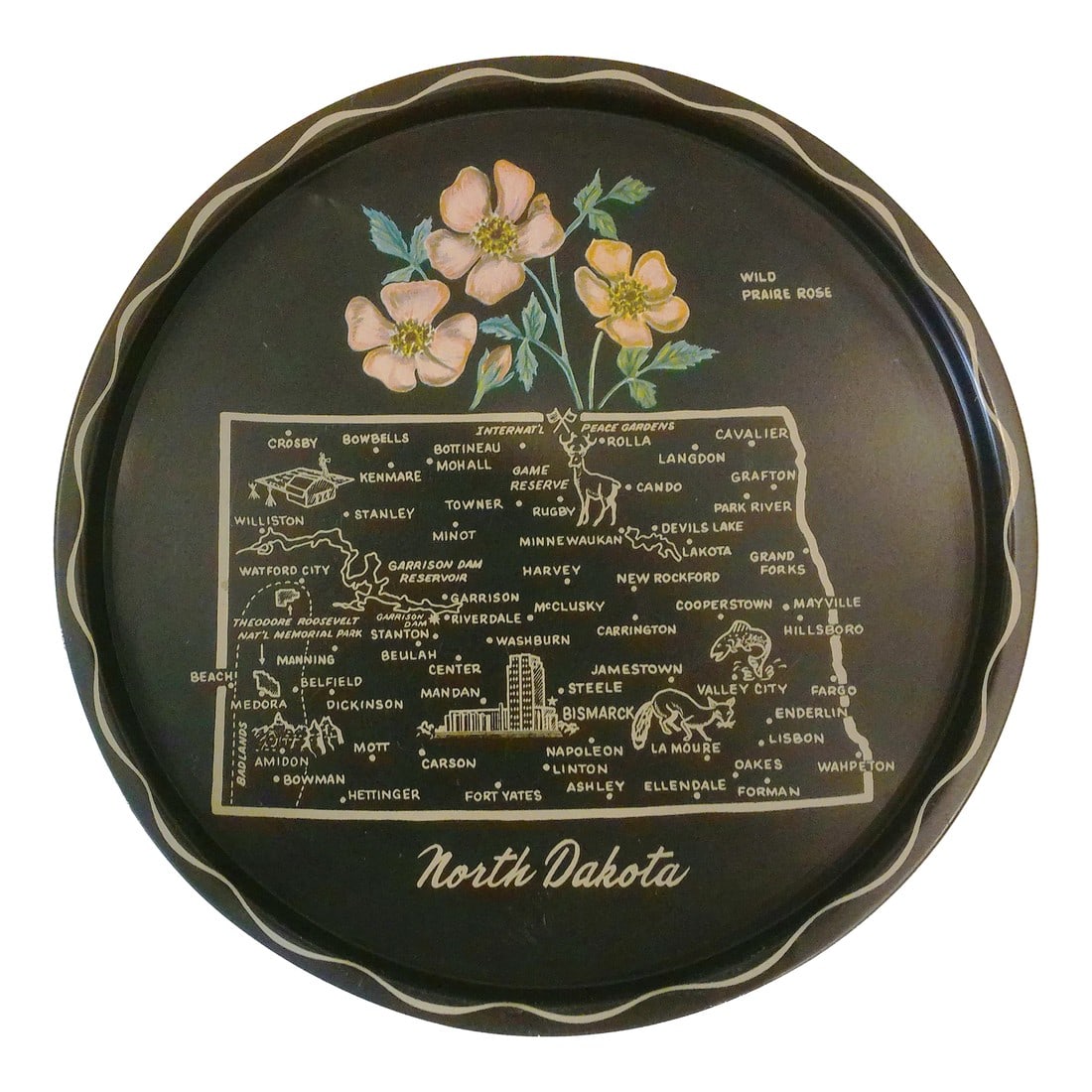 Mid-Century North Dakota Metal Tourist Tray: Nostalgic mid-century black metal tray featuring a map of North Dakota in tan and depicting the state flower - the Wild Praire Rose, in shades of pink, yellow and green. Condition: Alterations: