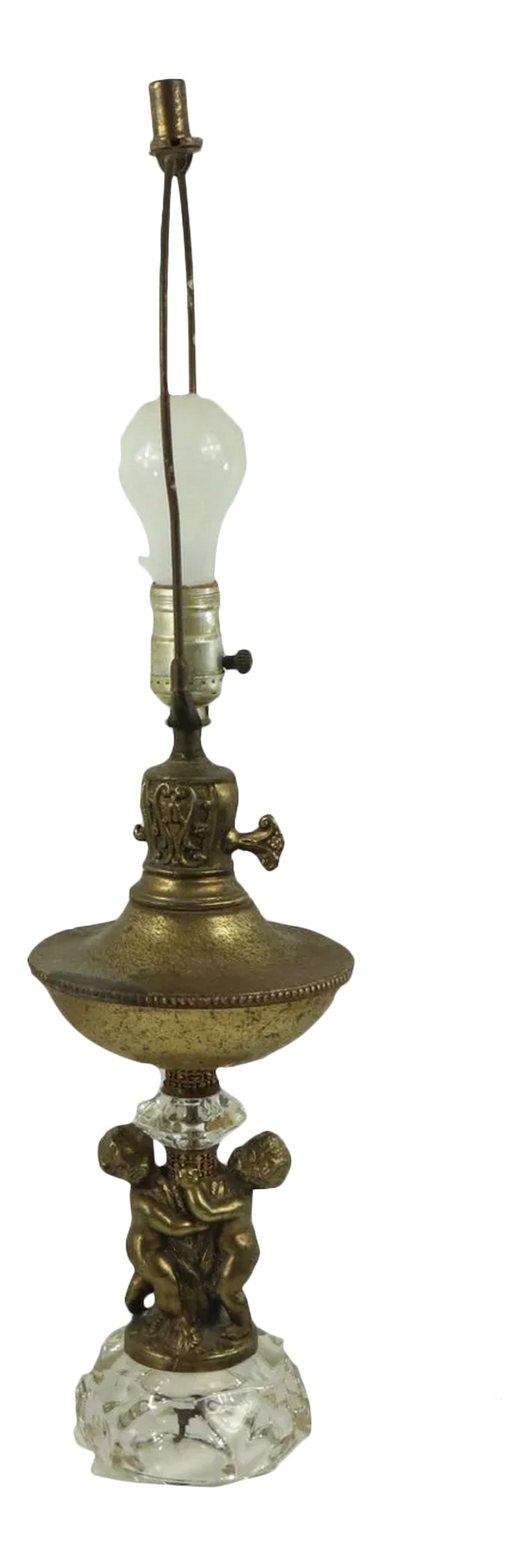 Vintage Hollywood Regency Vintage Brass Cherub Crystal Table Lamp: Vintage Brass Crystal Cherub Hollywood Regency Lamp Table Lamp Has patina on the brass and the cherubs. No lampshade Does not come with a light bulb. Tested and works Measurements: 25 inches from top
