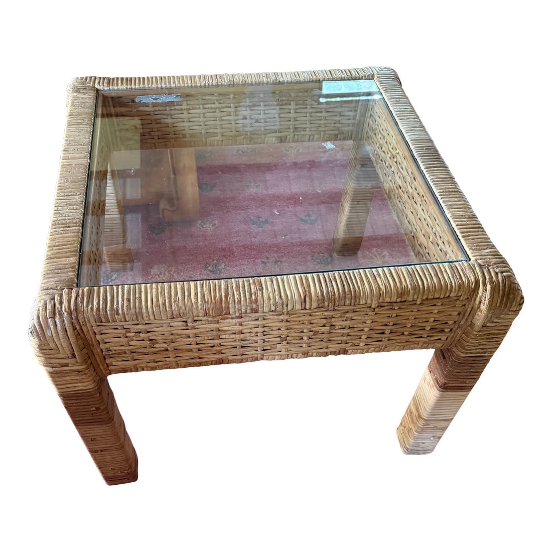 Chic Coastal Rattan Glass Top Square Table: Coastal chic modern square coffee table is wrapped in solid rattan with a beautiful glass top waiting for your coffee cup and cat to curl up on. Condition: Alterations: Original Condition Unaltered