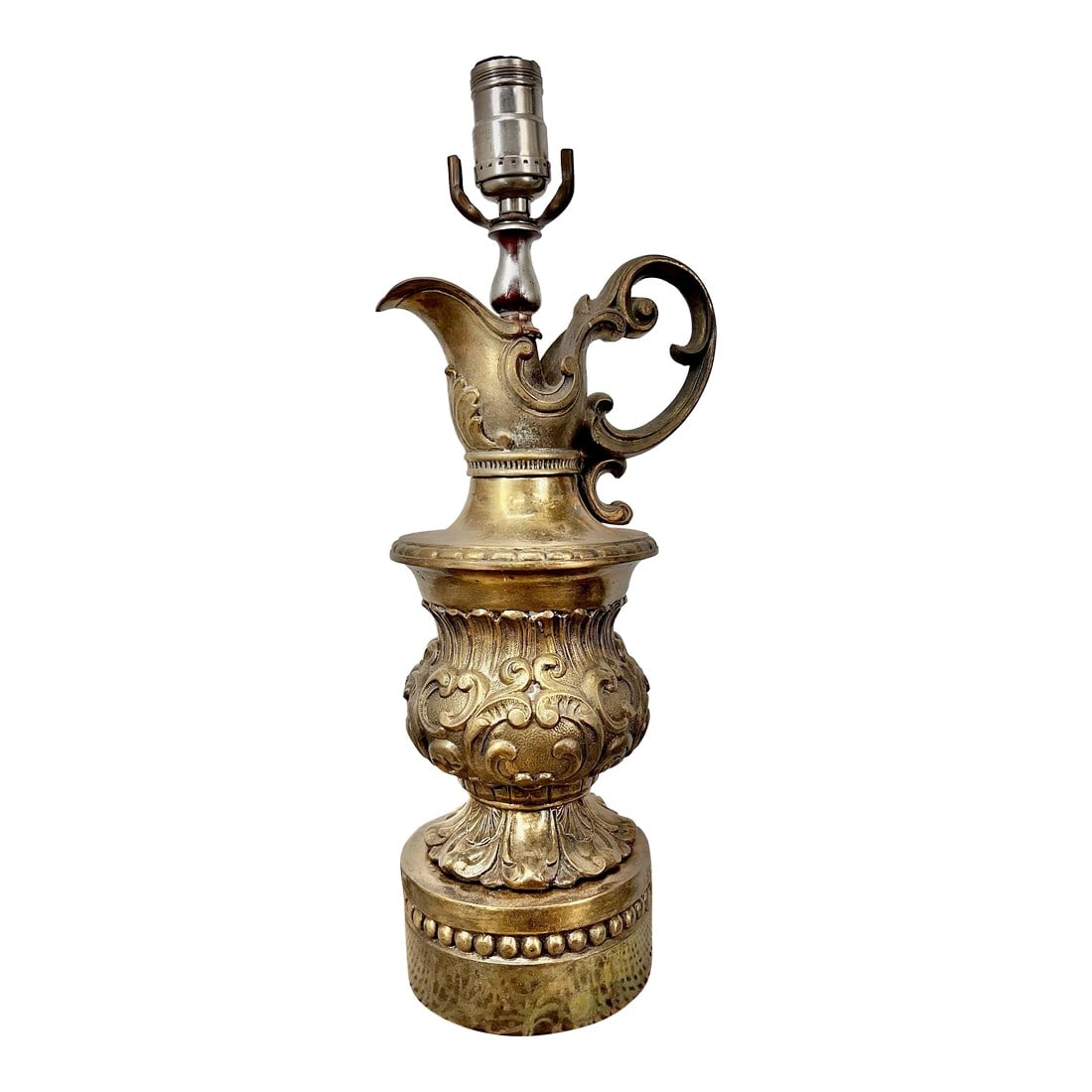 Vintage Ornate Classical Decanter Pitcher Solid Brass Lamp: This exquisite vintage brass ewer pitcher lamp exemplifies timeless elegance and craftsmanship. Constructed from solid brass with a rich, aged patina, the lamp showcases intricate scrollwork and refin