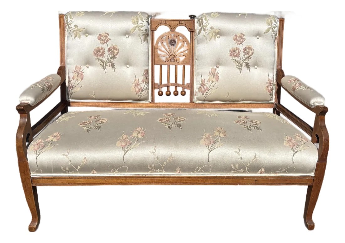 Late 19th Century Attributed Eastlake Walnut Settee with Pink Floral Upholstery: This piece brings a romantic blend of craftsmanship and charm. Hand-carved from rich walnut, its sculpted frame showcases the artistry of the late 19th century, while the soft pink floral upholstery a