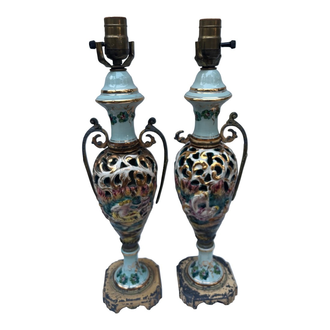 Early 19th Century Two Matching Antique Capodimonte Italian Pottery Lamps With Nude Figures Portraye: Illuminate your space with the irresistible romance and artistry of these two matching antique Capodimonte Italian pottery lamps, each exquisitely sculpted with elegant nude figures that embody the fl