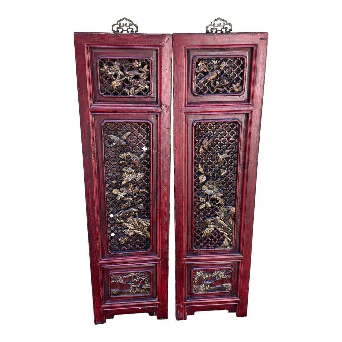 1875 Chinese Red Intricate Wooden Carved Door Panels in Gold, a Pair: Each panel showcases deeply carved florals, mythical motifs, or symbolic patterns that speak to prosperity and protection, all preserved in a rich red lacquer that has mellowed beautifully with age.