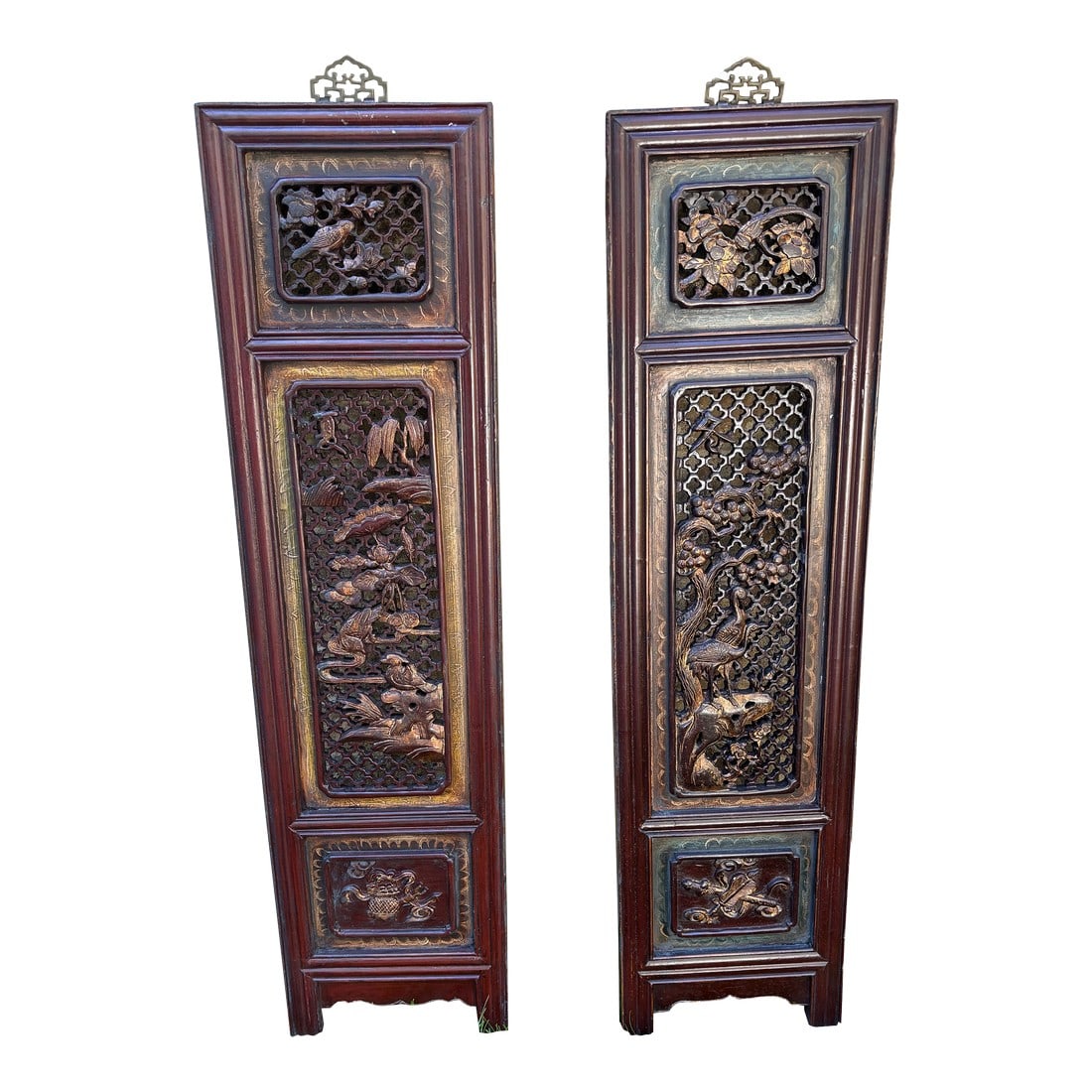 1875 Chinese Red Intricate Wooden Carved Door Panels in Gold Color Accent, a Pair: Each panel showcases deeply carved florals, mythical motifs, or symbolic patterns that speak to prosperity and protection, all preserved in a rich red lacquer that has mellowed beautifully with age.