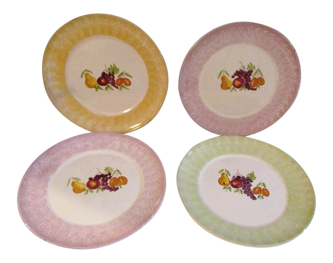 1980s Italian Hand-Painted Fruit Pottery Plates, Set of 4: Charming set of four colorful Italian pottery plates featuring a hand-painted fruit motif in center and sponge painted design around perimeter. Marked underside "Lamas Made in Italy." Lovely for displ
