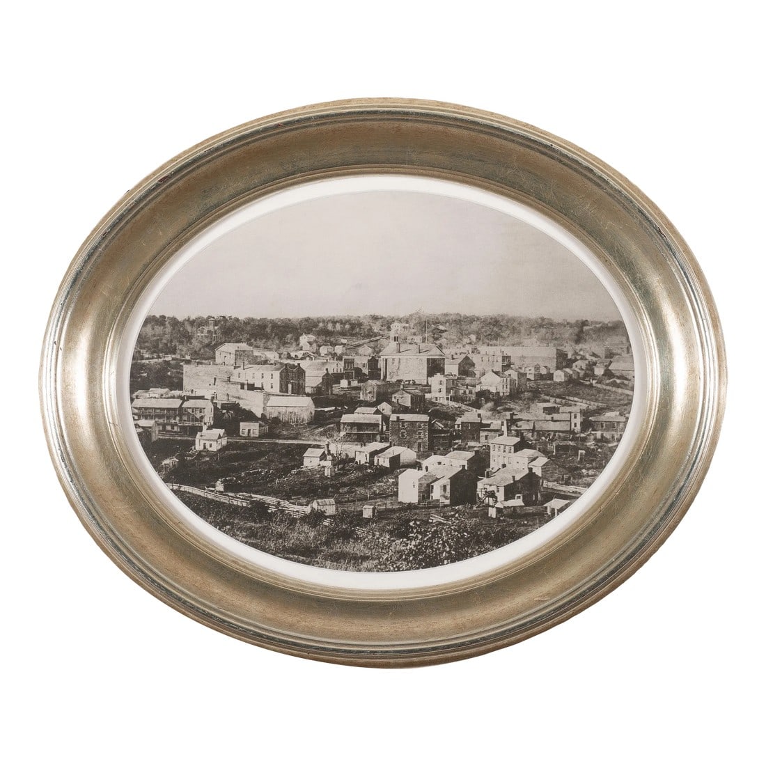 Oval Framed Photograph of Mineral Point, Wisconsin, 1850-75: Oval format photographic view of Mineral Point, Wisconsin from the southwest, looking northeast. The work has been reframed in an oval silver leaf cove molding. American, Wisconsin, 1850-75. 