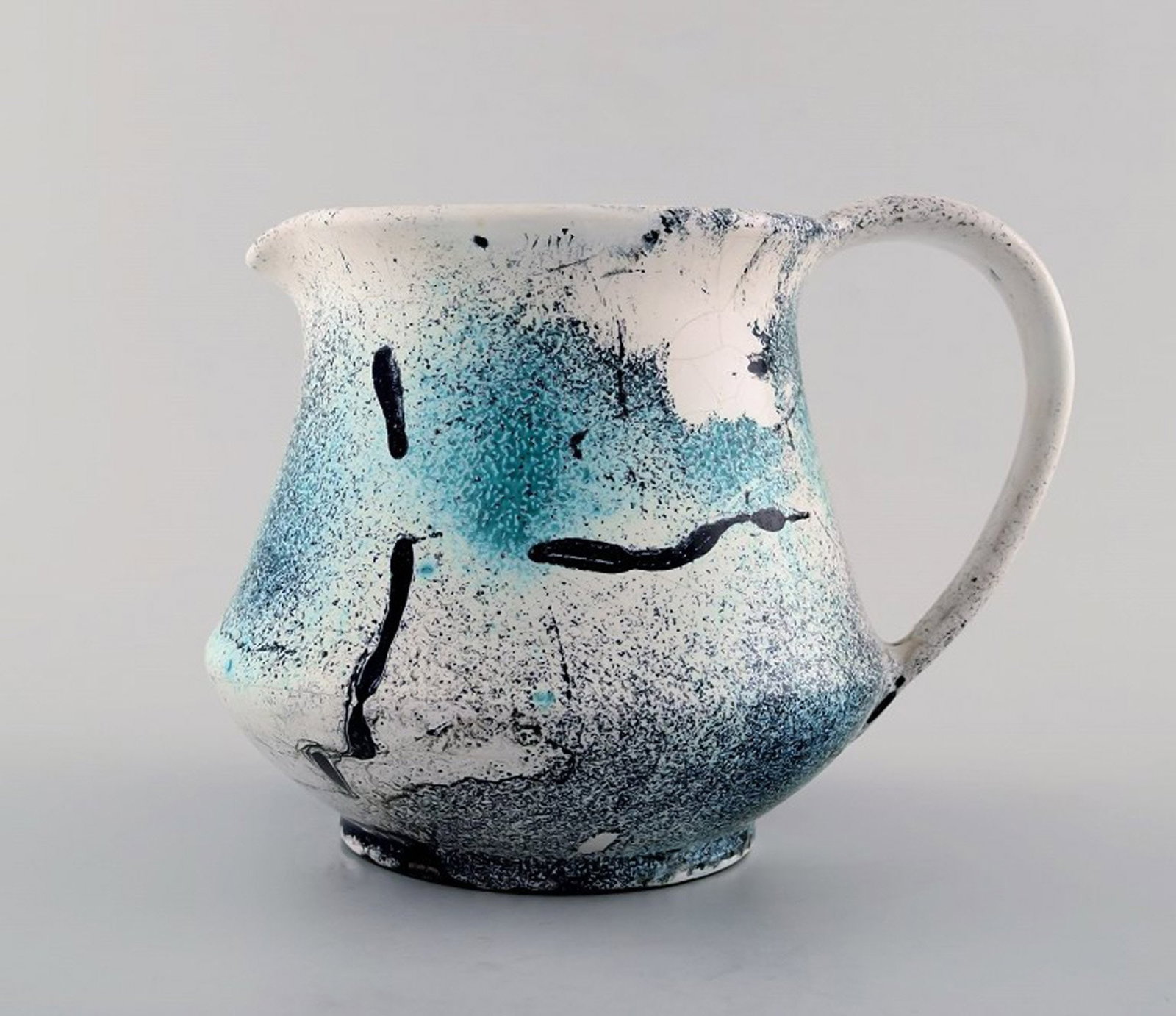 Jens Thirslund (1892-1942) Kähler pitcher decorated with greenish glaze.: Title: Jens Thirslund (1892-1942) Kähler pitcher decorated with greenish glaze. Description: Jens Thirslund (1892-1942) Kähler pitcher decorated with greenish glaze. Stamped HAK for Herman A