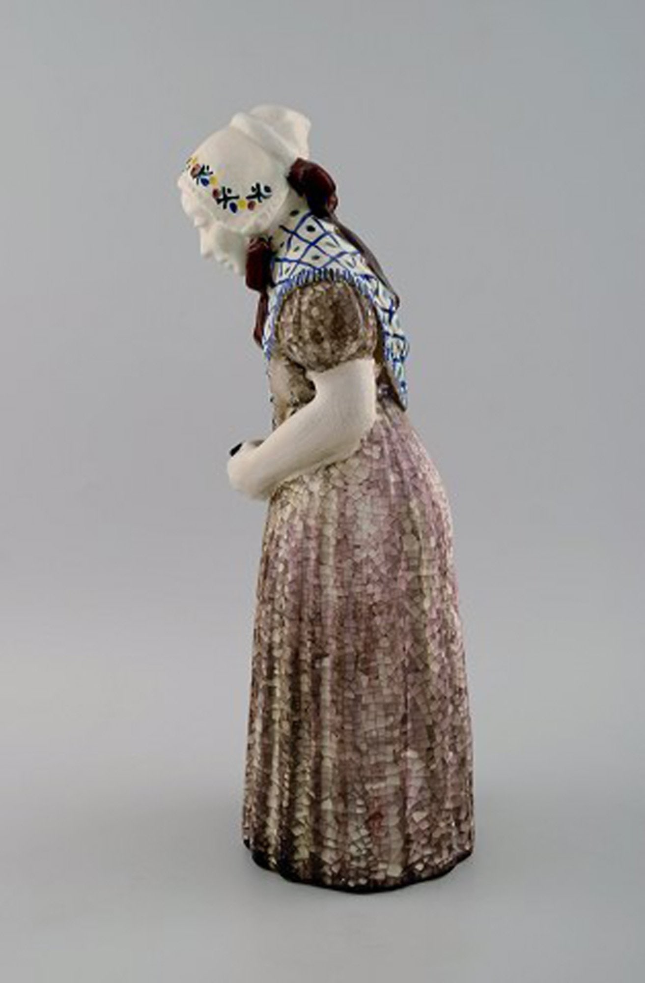 Michael Andersen Ceramics from Bornholm. Large figure of woman with Songbook in national dress. No. - 2