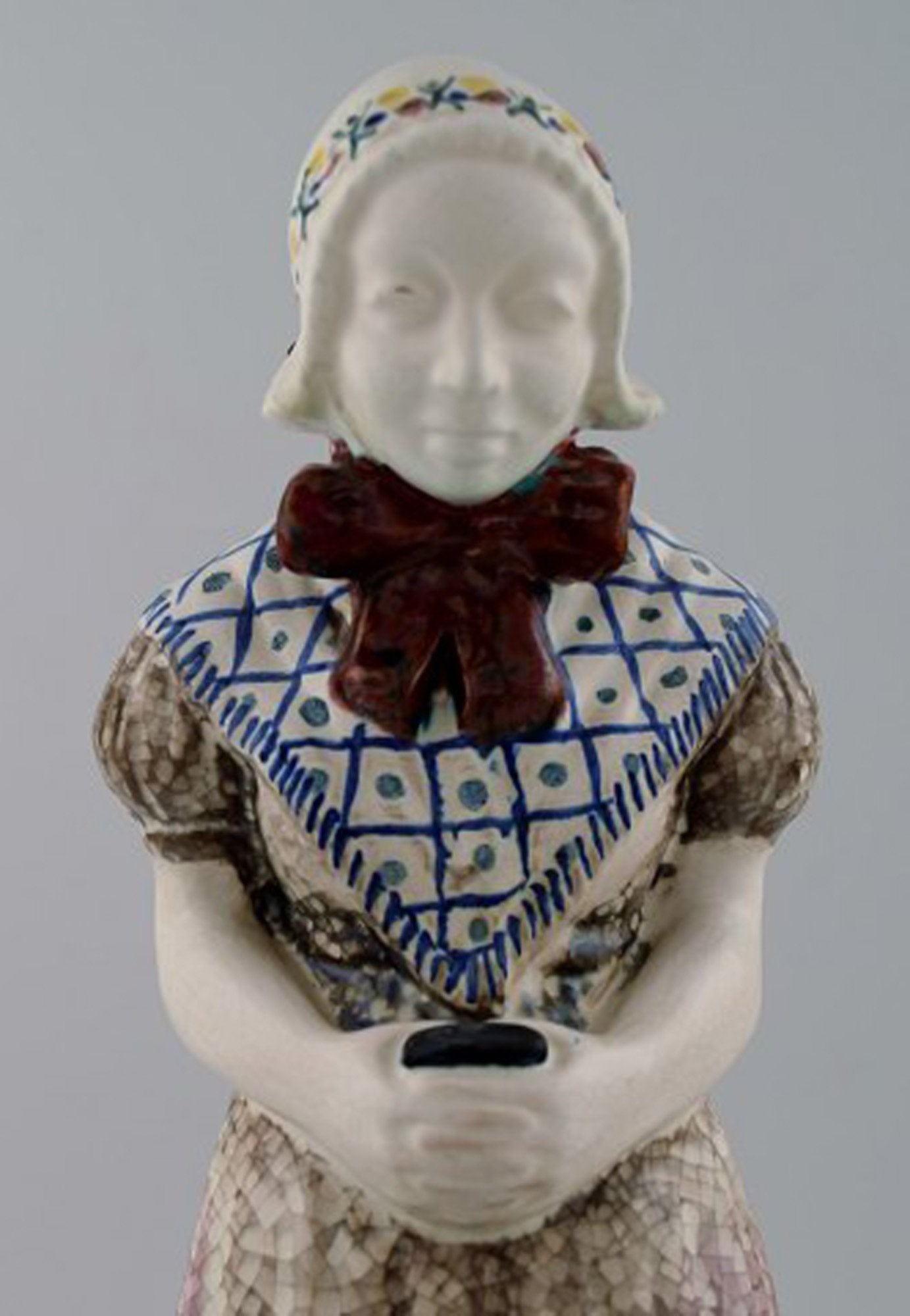 Michael Andersen Ceramics from Bornholm. Large figure of woman with Songbook in national dress. No. - 5