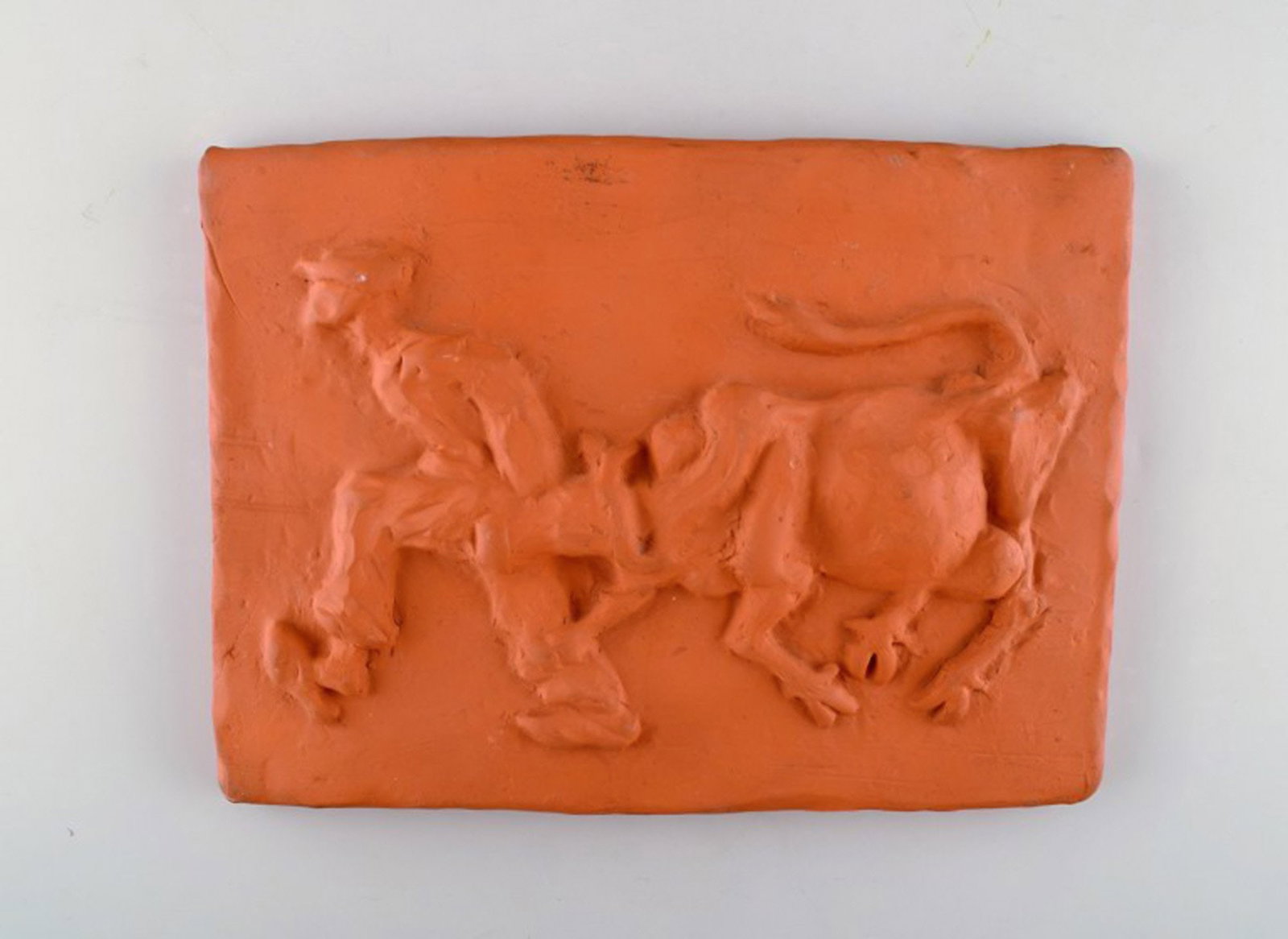 Kloster Ceramic, Ystad. Wall plaque in terracotta. The cow is driven home. Swedish design, 1960's.: Title: Kloster Ceramic, Ystad. Wall plaque in terracotta. The cow is driven home. Swedish design, 1960's. Description: Kloster Ceramic, Ystad. Wall plaque in terracotta. The cow is driven home. Swedis
