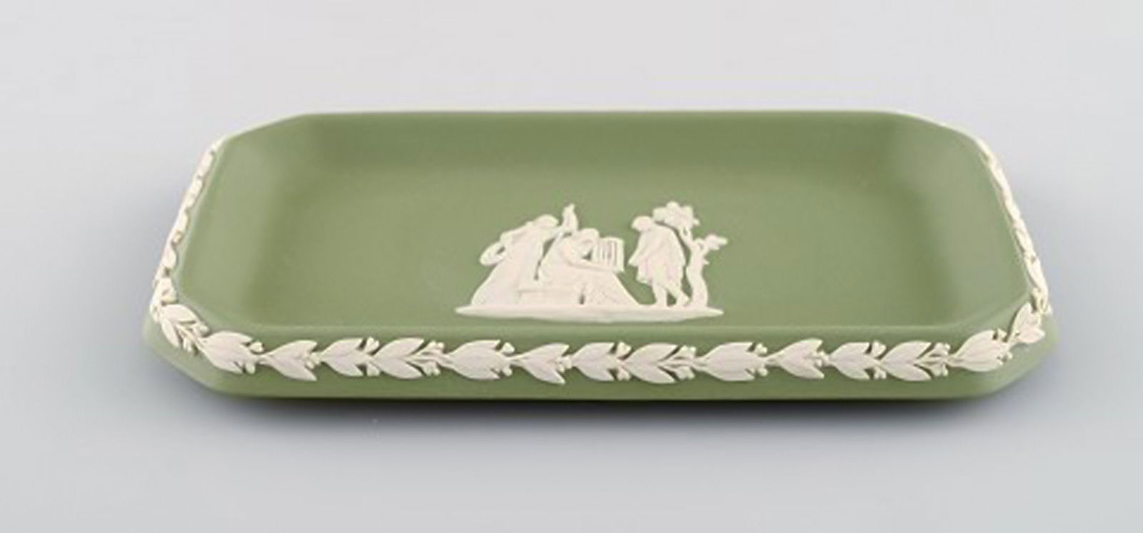 Wedgwood, England. Small square dish in green stoneware with classicist scenes in white. Approx. - 2