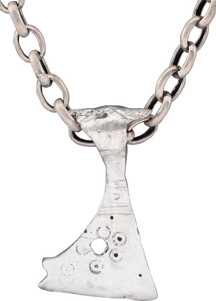 FINE VIKING VOTIVE AXE NECKLACE, C.850-1050 AD: Silvered bronze axe, just under 1 3/4" (1.71") height, of iconic Viking battle axe form with circular socket flared front and back for stability on the haft. Back swept bearded bit, pierced with a sin