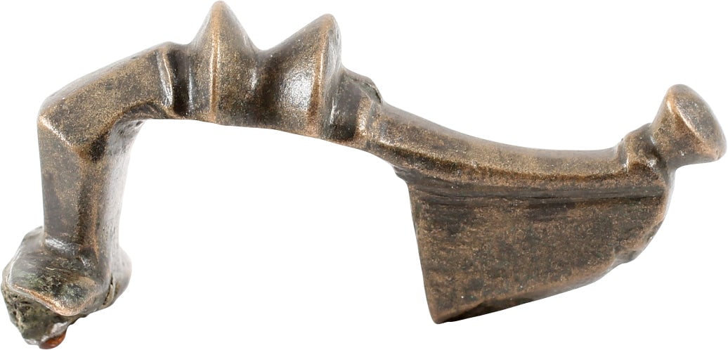 ROMAN FIBULA, LATE 2ND-5TH CENTURY AD: Riha type B3, (Die romischen Fibeln aus Augst und Kaiseraugst) with independent spring on an axel pierced through the bow base. Bronze, 1 1/2” length. Elegant tapered bow with a flared base and