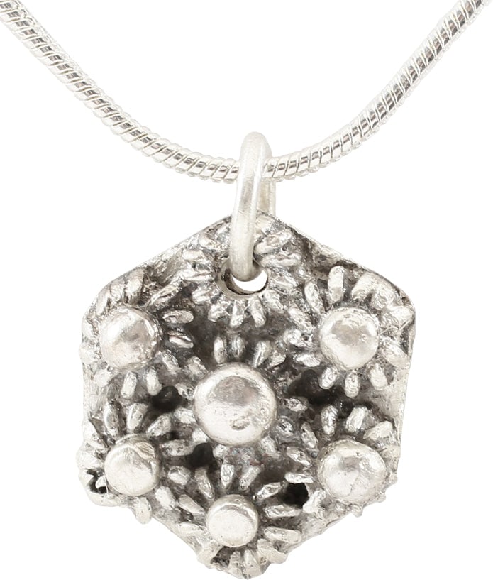 FINE ROMAN WHEEL OF FORTUNE AMULET, 3RD-6TH C.AD: 3rd-5th Century. 5/8" width (0.62"). Ringed central hub with eight radials with terminals matching the hub. Each comprising a bun form center on a radially reeded base. Made by the open face mold