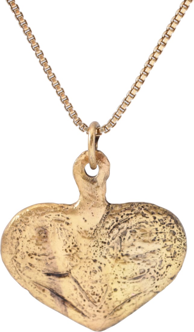 ANCIENT VIKING HEART PENDANT NECKLACE C.850-1050 AD: Iconic heart form. Over 5/8” (0.69”) height including the suspension loop. The broad edges scrolling at the top forming the cusp and the top two members of the trefoil on the depressed fie