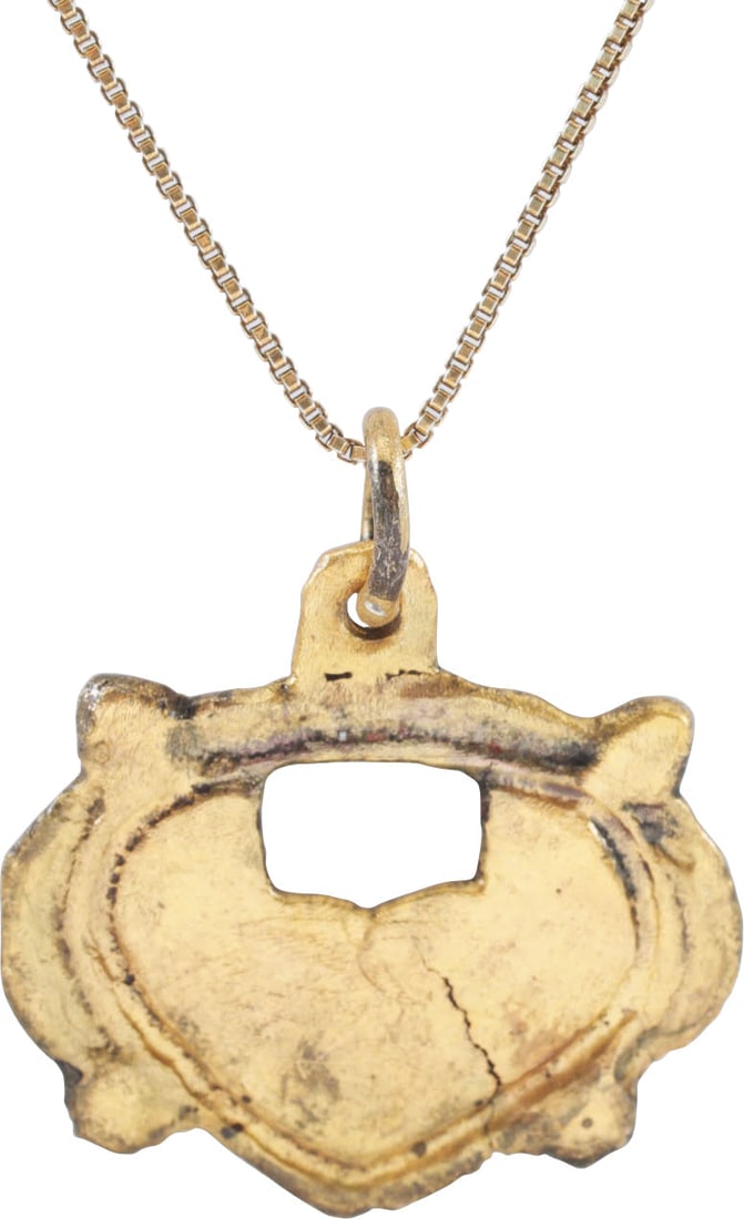 SUPERB ANCIENT VIKING HEART PENDANT NECKLACE, C.950-1050 AD: Over 3/4" (0.81”) height plus the suspension loop. The heart of archaic or natural form with rounded top, over rectangular piercing, double bordered, superimposed on a saltire represented as nub