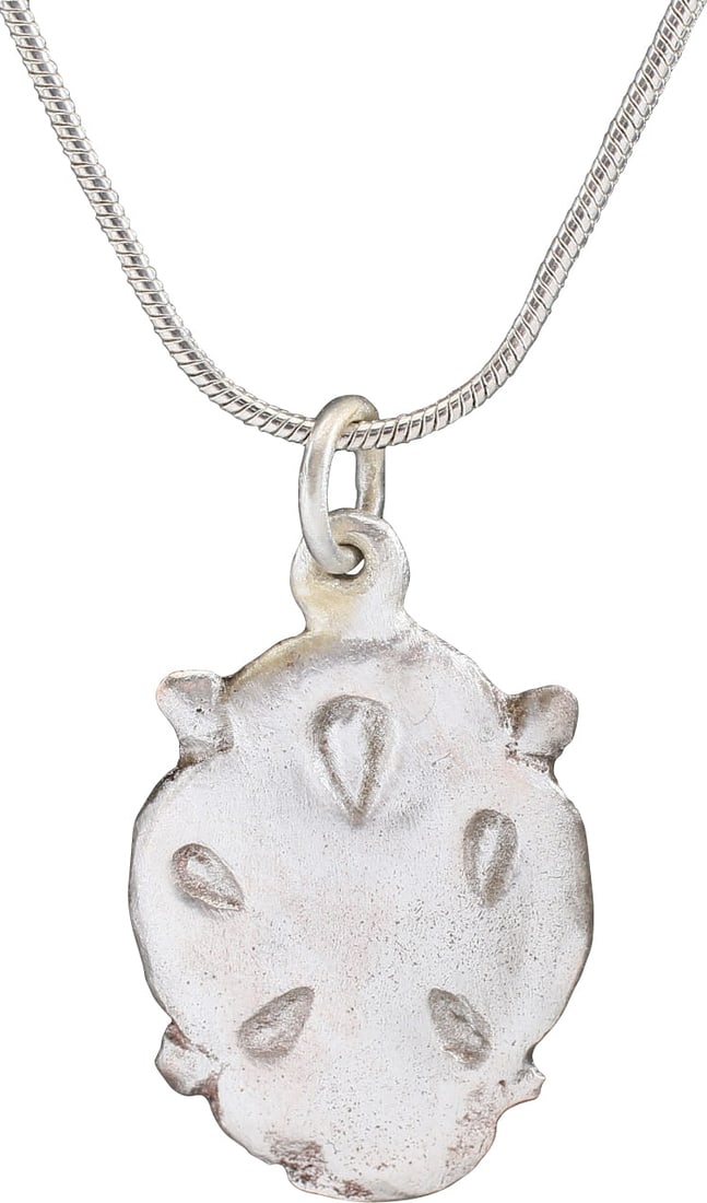 SCANDINAVIAN NORSE PENDANT NECKLACE, 12TH-13TH CENTURY: Period of conversion to Christianity of the Vikings and adapting and old Viking favorite form, the heart. A little over 1" (1.04" �) total height. Quatrefoil form with quartered nubs defining