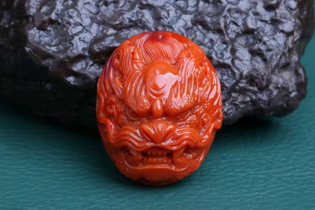 Nanhong Agate Pendant - Dragon: Title: Nanhong Agate Pendant - Dragon Origin: Chinese Date/Period: After2022 Materials: Nanhong Agate Dimensions: 30x24.7x15.4(mm) 1.18x0.97x0.61(inches) Weight 0.03 lbs/13.7g Reserve: