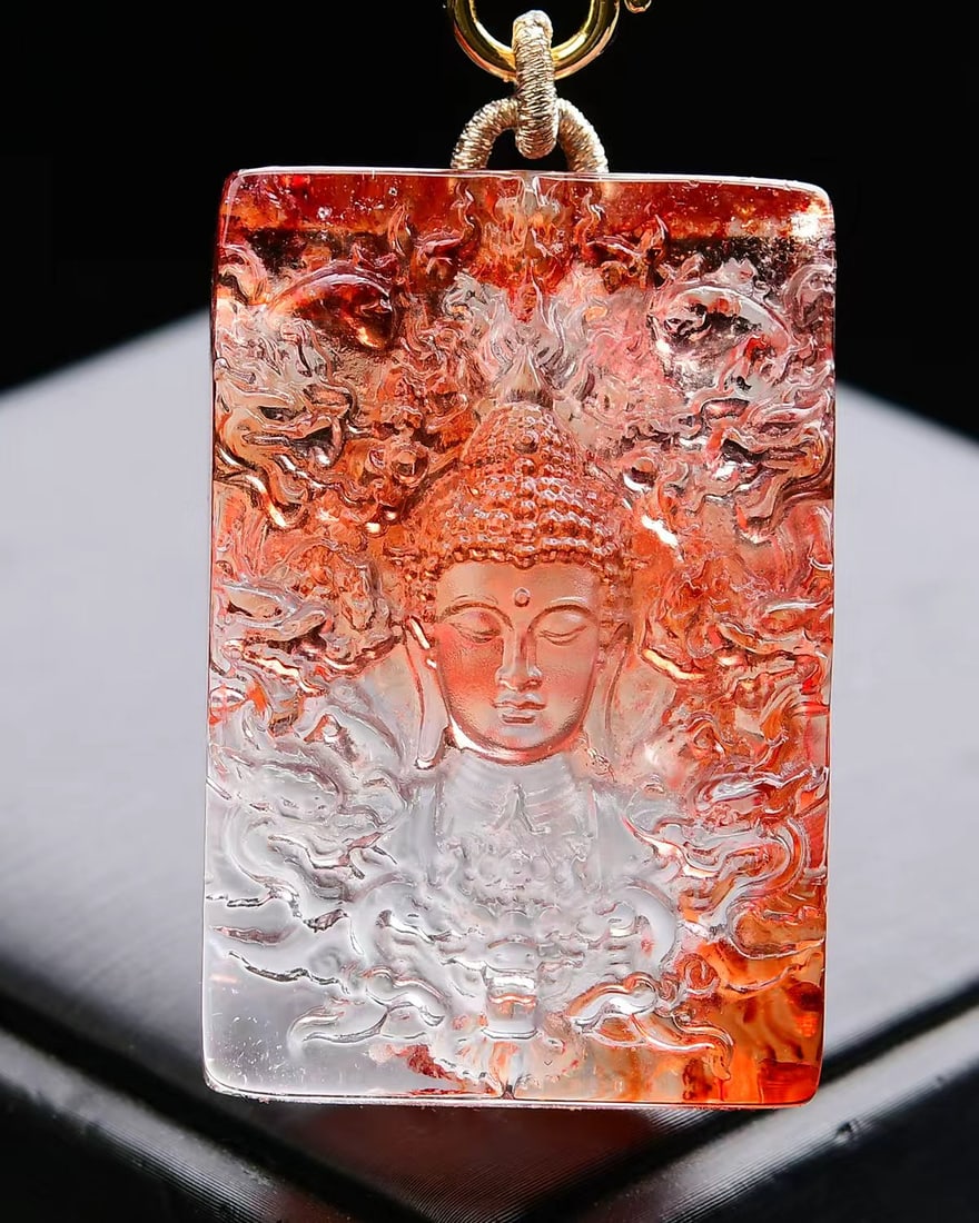Orange Crystal Pendant - Buddha: Title: Orange Crystal Pendant - Buddha Origin: Chinese Date/Period: After2025 Materials: Crystal Dimensions: 49x33x13(mm) 1.93x1.30x0.51(inches) Weight 0.16 lbs/74.5g Reserve: $485.00 Shipping:<